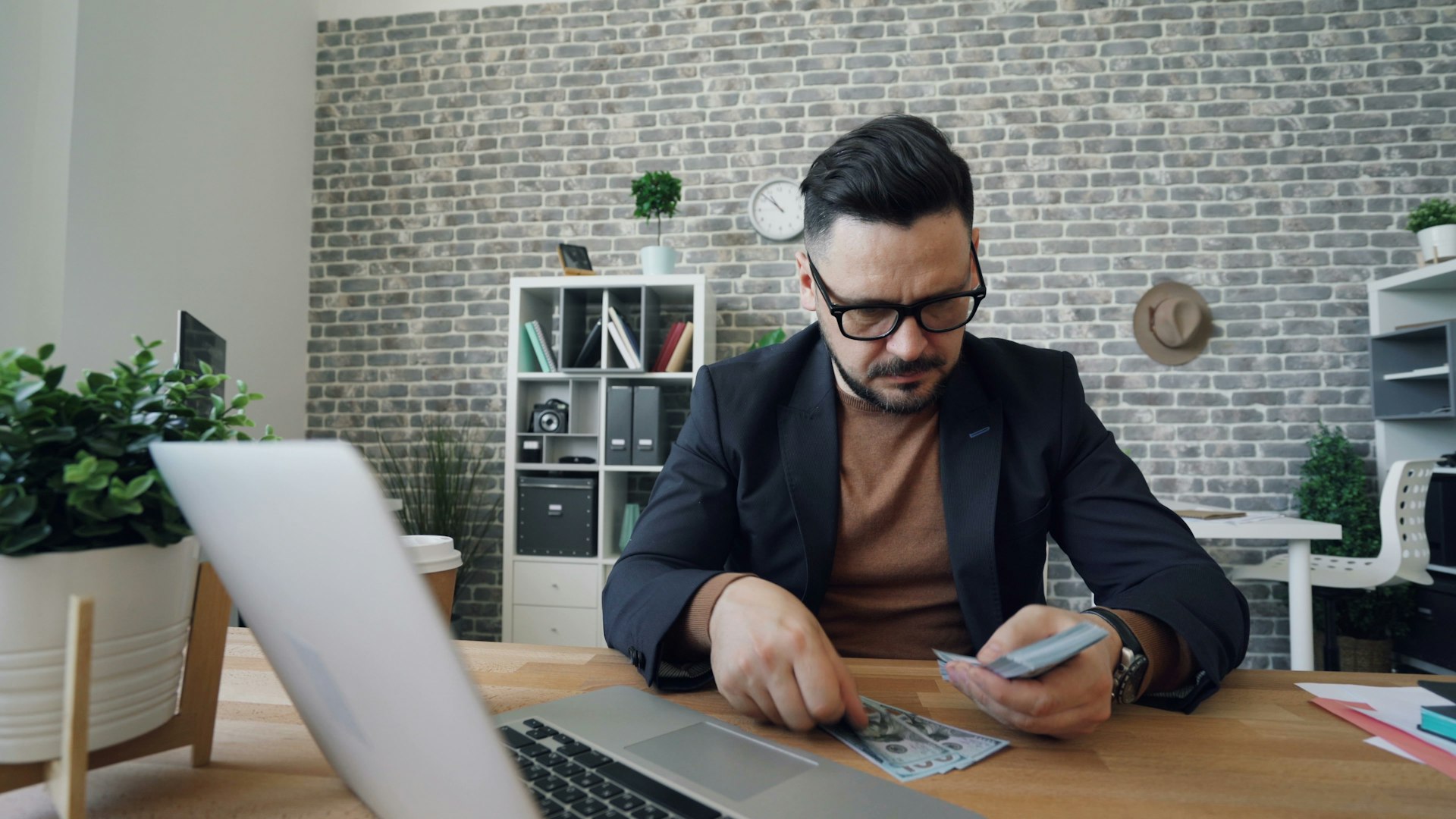 Nonprofit finance lead reviewing the annual budget on a laptop