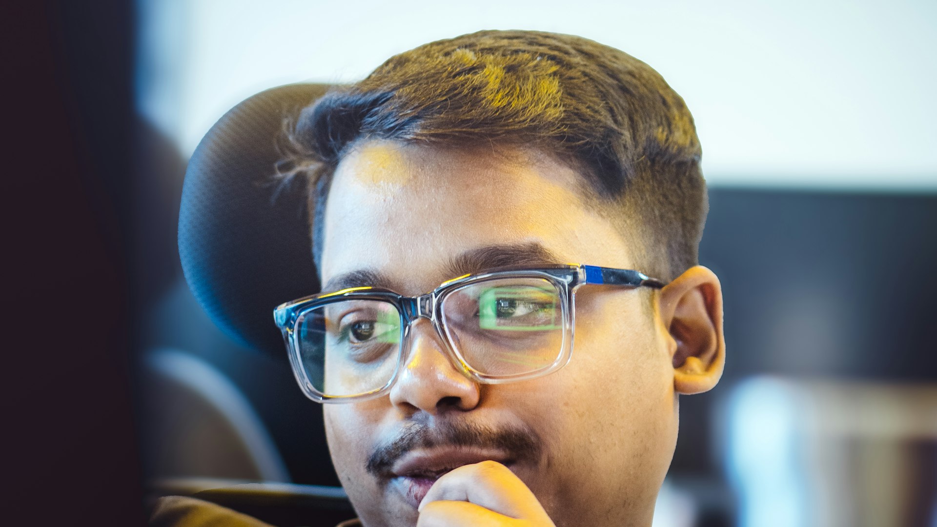 Staff member pausing to reflect during a demanding period