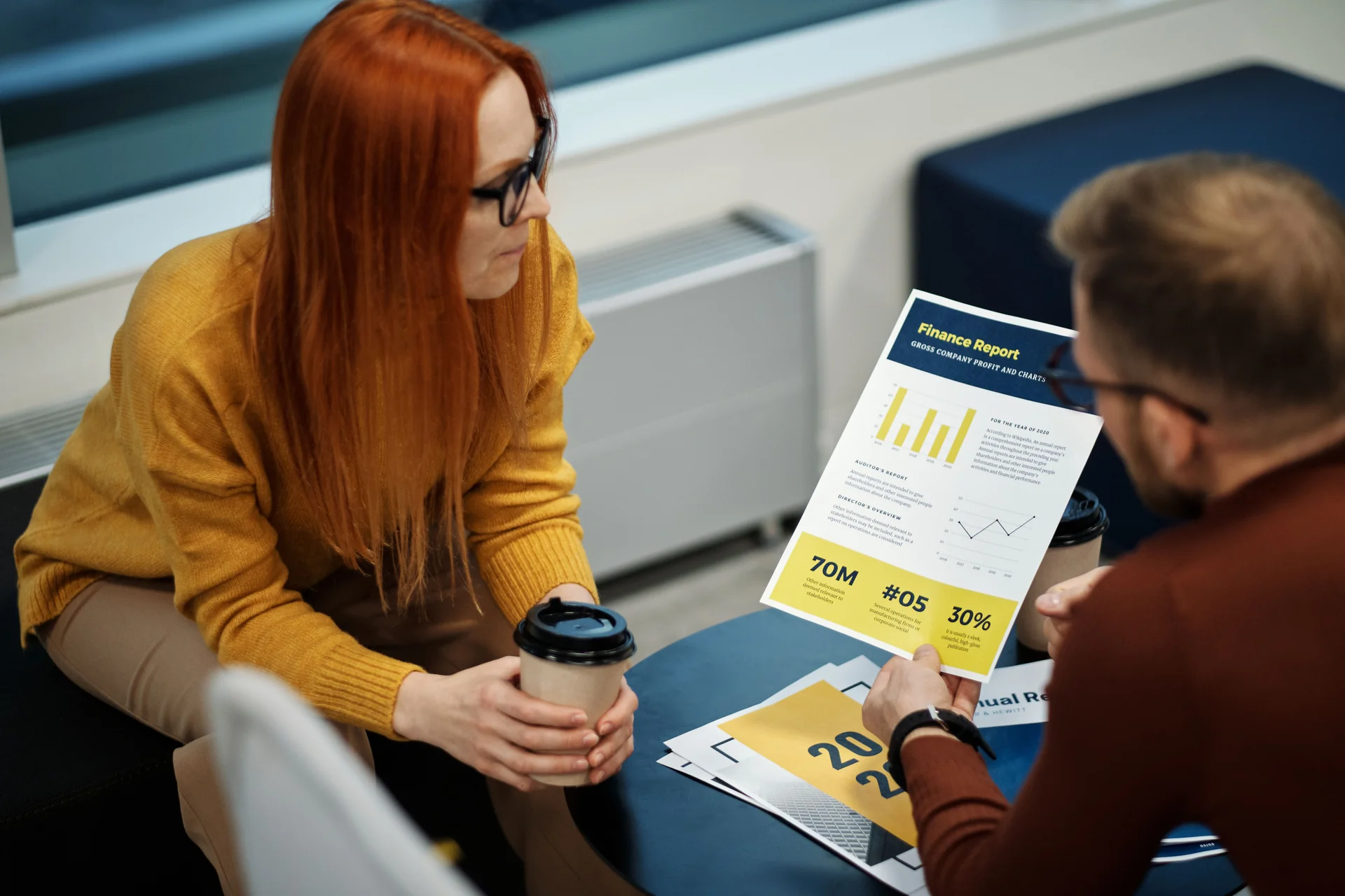 Two people reviewing a document together